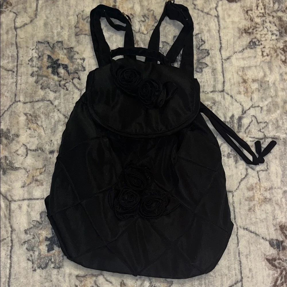 Joy Susan mini Black Quilted Backpack with Rosette Accents